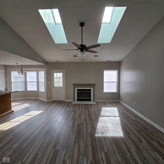 Skylights...fireplace...new flooring...the perfect great room... | Image 9