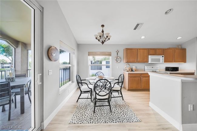 In-Formal Dining area with Big lake View and Lots of light off the Lanai, New Hurricane windows and Sliding door | Image 4