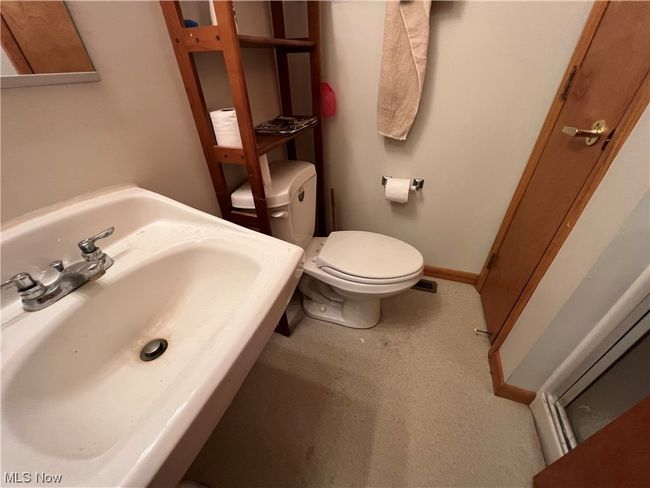 Bathroom featuring toilet and sink | Image 10