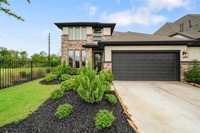 Welcome to 17930 Miller Springs, a modern two-story home located on a highly desirable lot. Only one side neighbor with direct access to a walking trail! No rear neighbors on a cul-de-sac! | Image 1