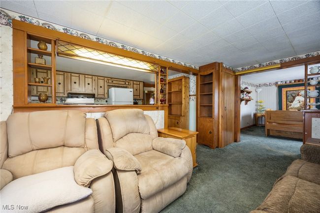 View of carpeted living area | Image 12