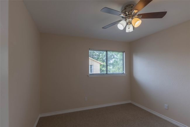Carpeted spare room with baseboards and ceiling fan | Image 22