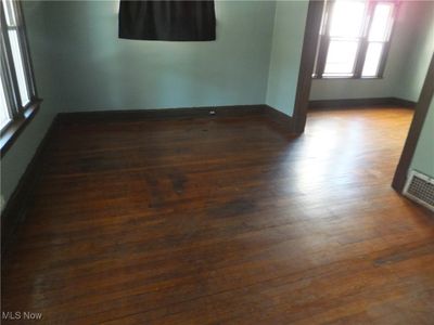 Spare room featuring dark hardwood / wood-style floors | Image 3