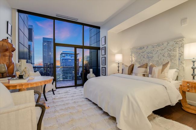 Wake up to breathtaking views through expansive windows that flood the room with morning light. | Image 20