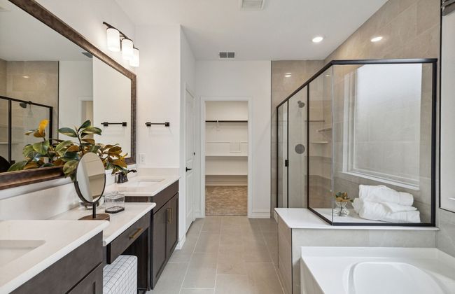 Luxurious owner's bath complete with double sinks and a generous shower *Model representation | Image 13