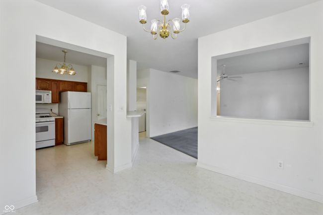Dinring Area facing Kitchen and Living Room | Image 11
