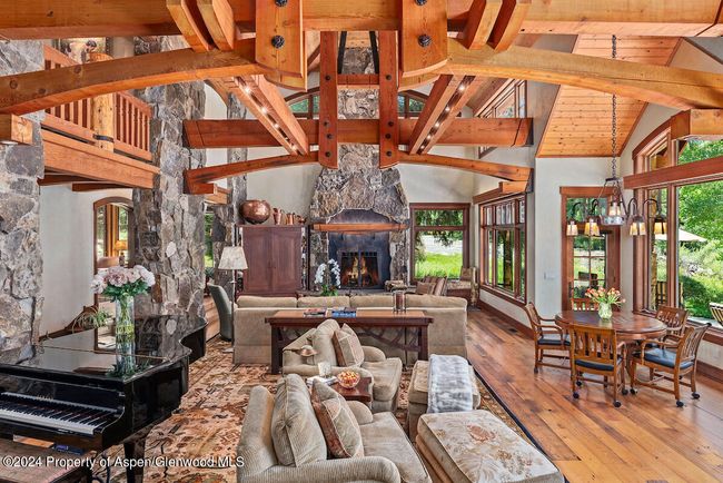 The design of this majestic, yet intimate, room was inspired by the 1920's Grand Lodges of the National Park Service. Knotty pine ceilings, wormy chestnut floors, and Douglas Fir elsewhere, all reclaimed. | Image 7