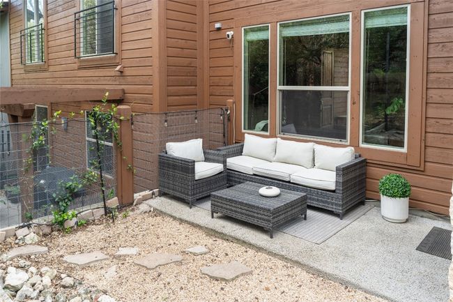 View of patio featuring outdoor lounge area | Image 33