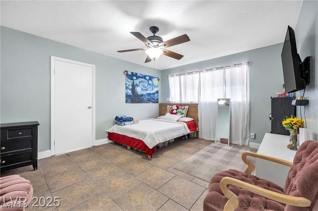 Bedroom featuring baseboards and a ceiling fan | Image 21