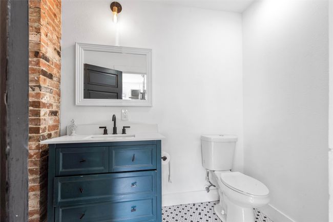 Bathroom featuring vanity and toilet | Image 23