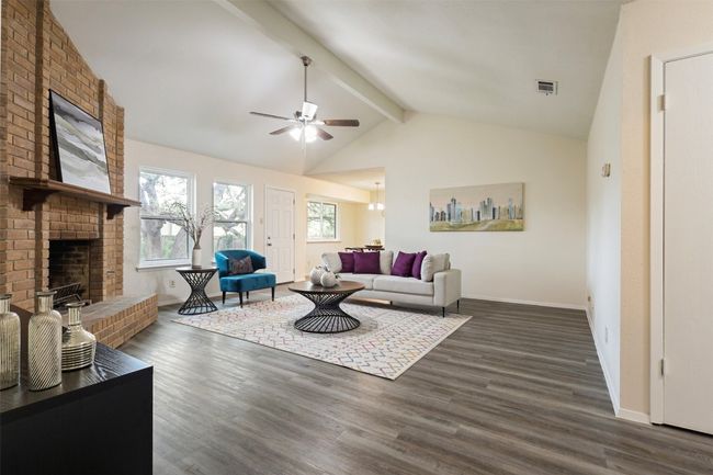 Living room with windows overlooking backyard. | Image 4