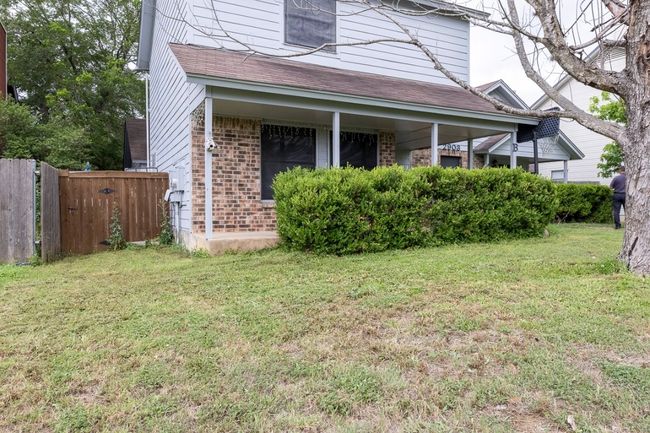 View of home's exterior with brick siding | Image 4