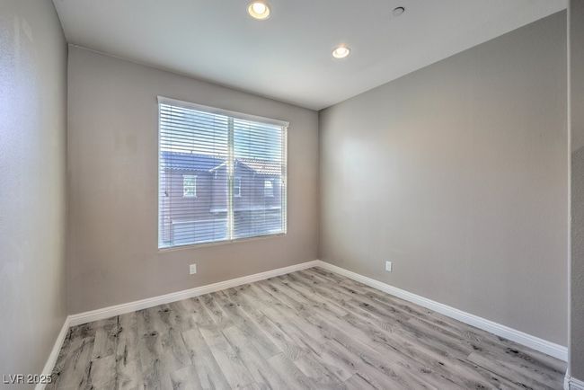 Empty room with baseboards, light wood-style flooring, and recessed lighting | Image 22