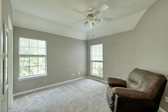 Sitting room featuring carpet flooring, baseboards, and ceiling fan | Image 25