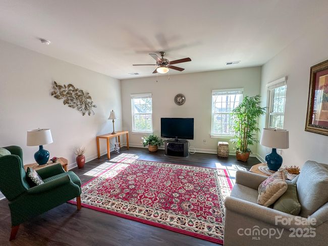 Spacious living room open to the kitchen. | Image 10