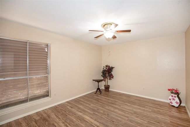 The bedroom is a cozy retreat, offering plenty of space to relax and unwind. | Image 22