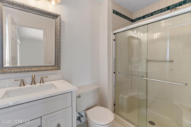 Primary En-suite Full Bath with shower featuring calming neutral tones. | Image 16