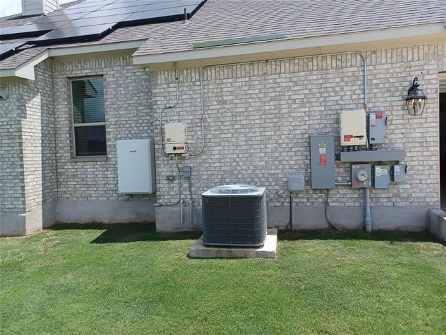 There's a battery back-up installed (Right of the window) for the solar panels. The home is also wired for two additional battery back-ups. | Image 39