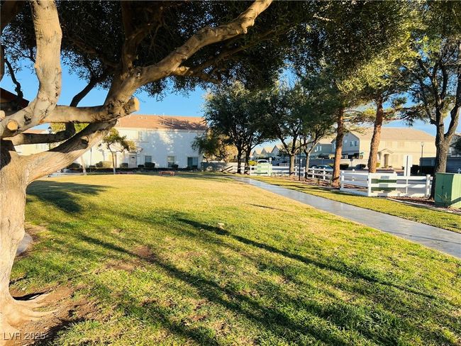 View of yard with a residential view | Image 20