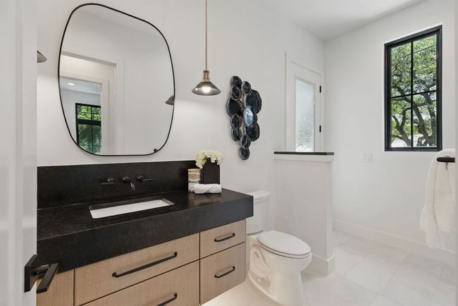 Bathroom featuring healthy amount of natural light, toilet, vanity, and tile patterned floors | Image 17