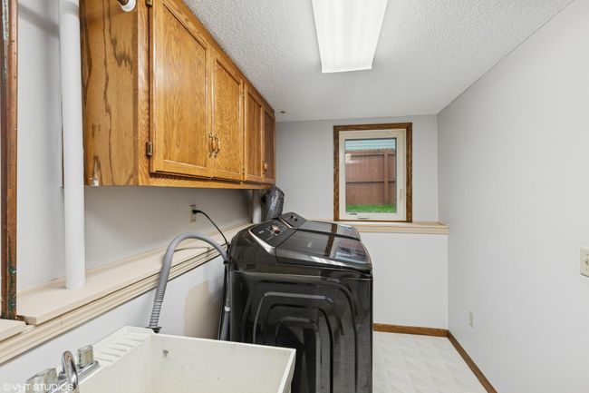 Laundry’s just steps away from the living room—perfect for folding while catching your favorite show | Image 35