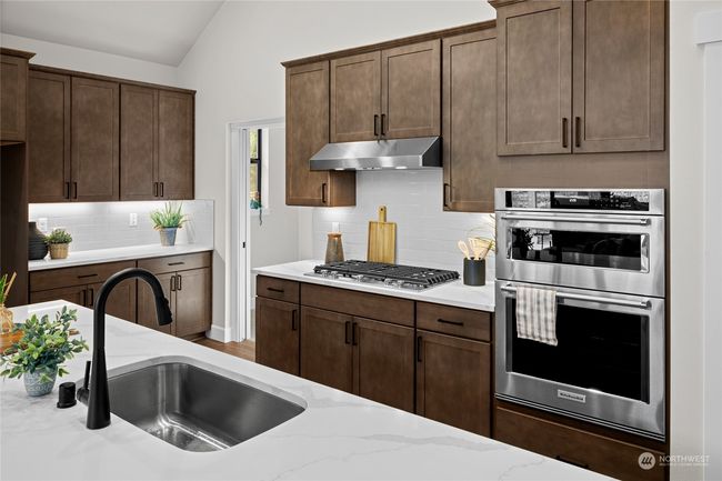 Kitchen with plenty of storage | Image 12