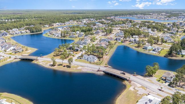 Aerial view featuring a wooded view, a residential view, and a water view | Image 33