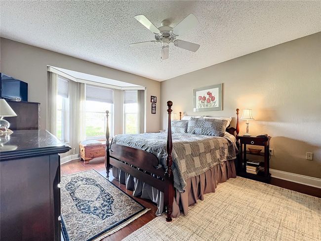 Primary Bedroom is spacious with bay window and golf course view | Image 5