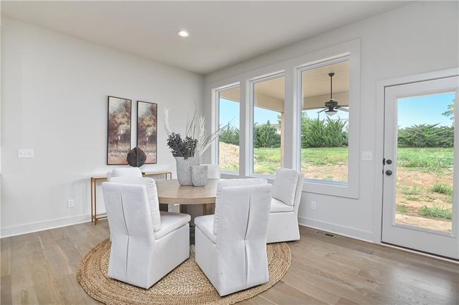 Dining space with ceiling fan, light hardwood / wood-style flooring, and a healthy amount of sunlight | Image 15