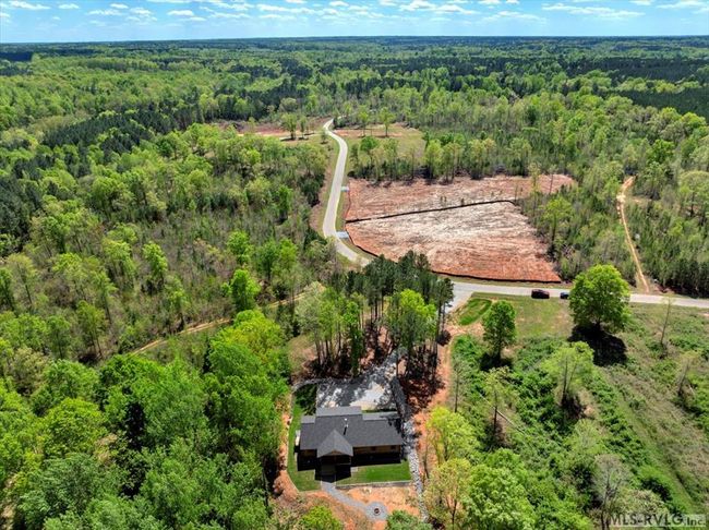 Aerial of property from lake to roadside | Image 13
