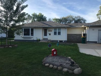 Nicely landscaped home with new roof and siding and nice landscaping | Image 1