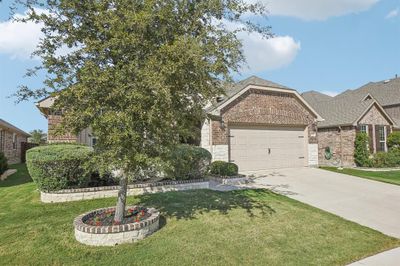 View of front of property featuring a front lawn and a garage | Image 2