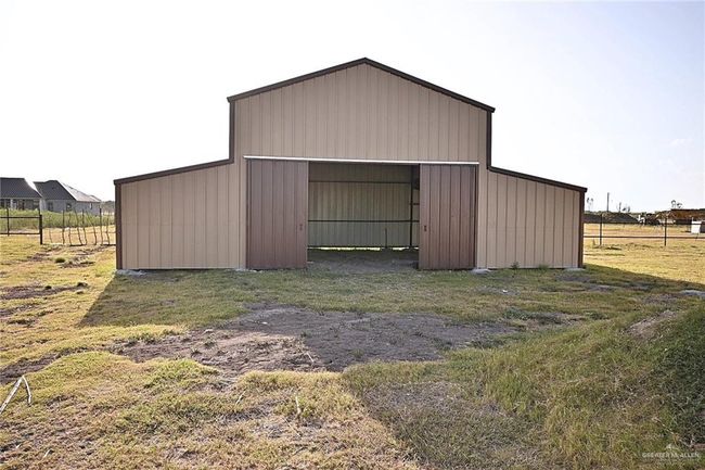 View of outdoor structure featuring a yard | Image 17