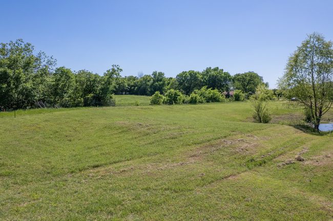 View of green lawn with a view of countryside | Image 23