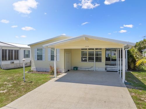 414 Macadamia Dr, Barefoot Bay, FL, 32976-6826 | Card Image