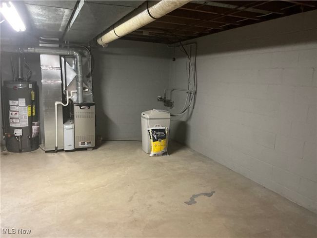 Basement with heating unit and water heater | Image 17