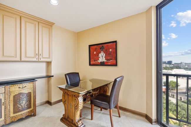 Breakfast nook featuring built-in upper cabinetry for storage. | Image 14