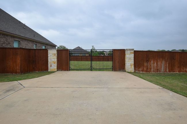 View of patio featuring a gate and fence | Image 25