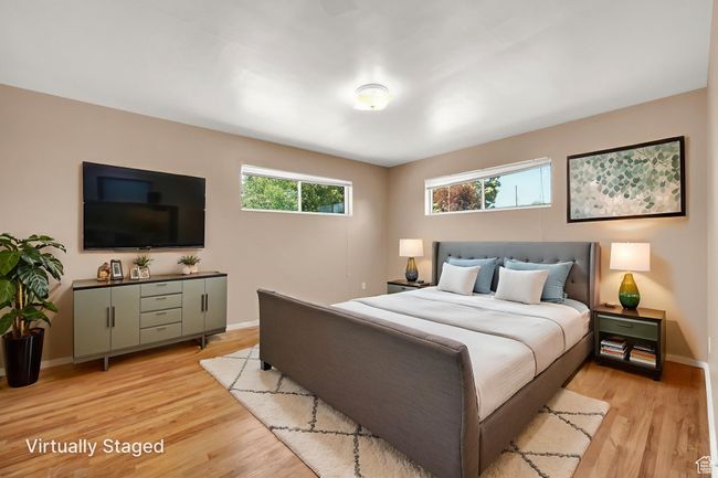 Bedroom featuring light wood floors and baseboards | Image 10
