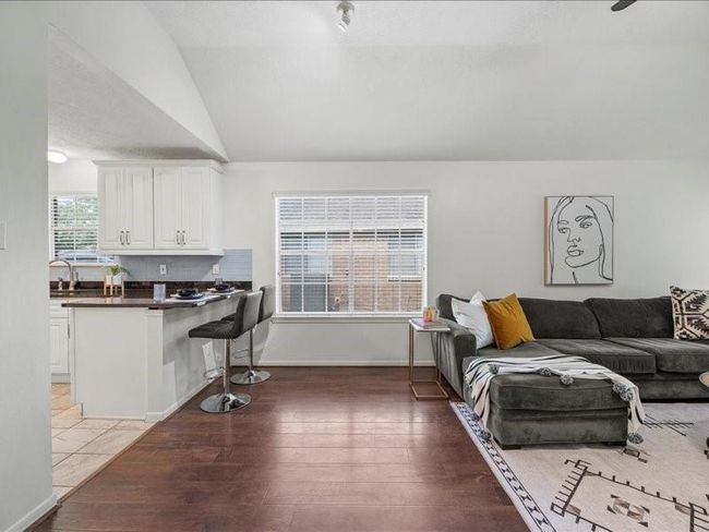 As you enter, you’re greeted by a warm, welcoming interior where natural light flows through the living spaces | Image 7
