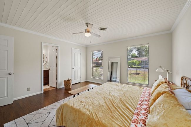 Note the updated shiplap ceiling and ceiling fan in the primary bedroom. | Image 17