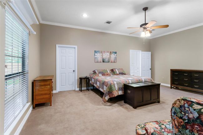 Oversized primary bedroom with walk in closet. | Image 17