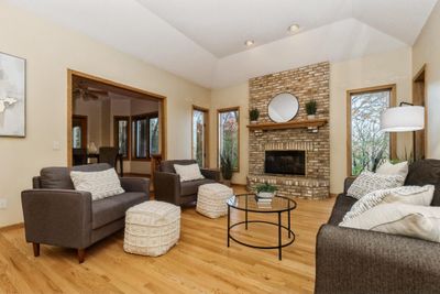 Warm and inviting main level living room with gas fireplace. | Image 3