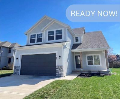 View of front facade featuring a garage | Image 1