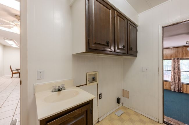 Washroom with washer hookup, a ceiling fan, and light floors | Image 23