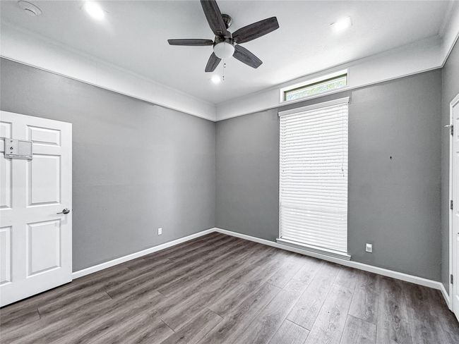 Spare room featuring wood finished floors and ceiling fan | Image 37