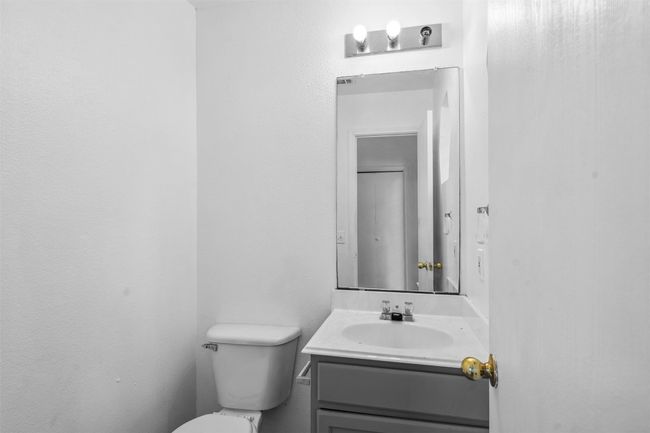 Half bath featuring vanity and toilet | Image 18