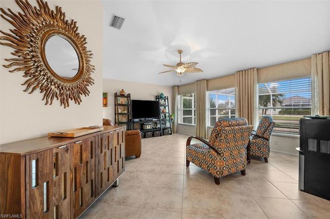 Living area with visible vents, ceiling fan, and light tile patterned flooring | Image 18
