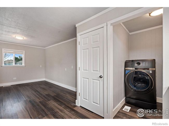 Great pantry space and convenient laundry off the kitchen. | Image 11