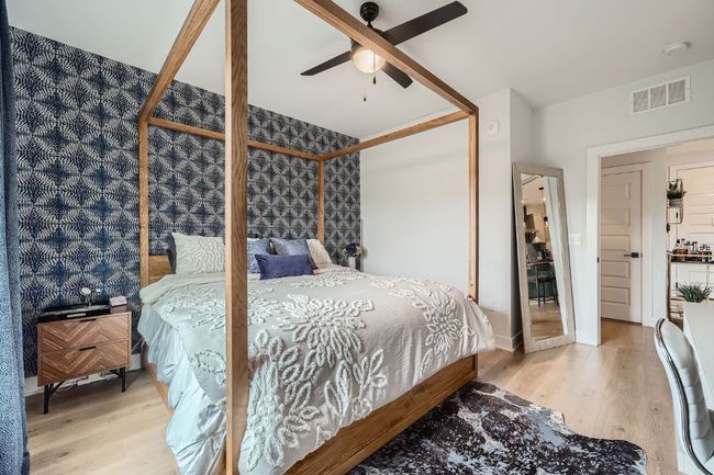 Bedroom with wood finished floors and a ceiling fan | Image 13